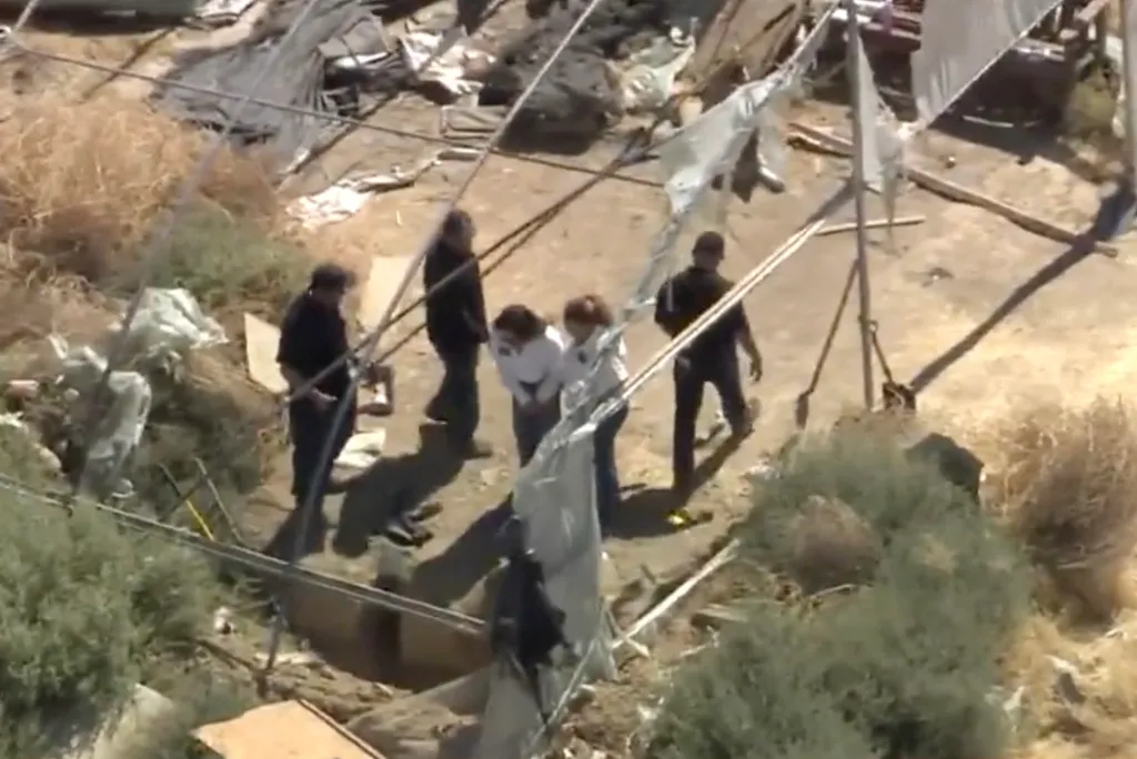 Aerial view of investigators at a remote site in Lancaster where human remains were discovered.