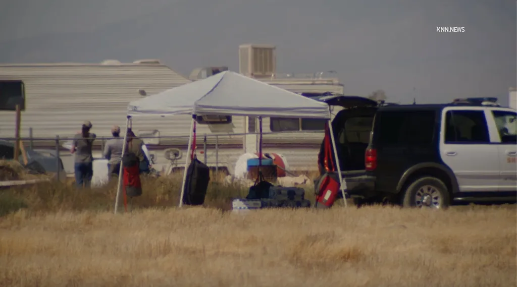 Law-enforcement presence near the intersection of 50th Street East and Avenue F, northeast of Lancaster, California, as authorities conduct an extensive search of the area.