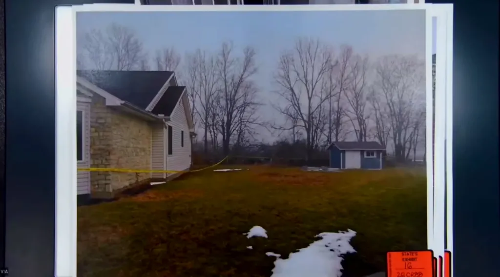 Exterior view of the Flynn home with yellow crime scene tape around the property.