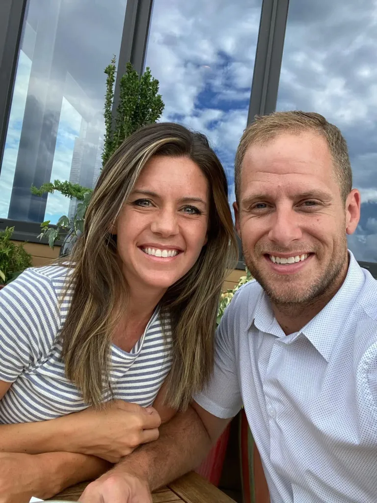 Caleb Flynn and Ashley Flynn smiling together.