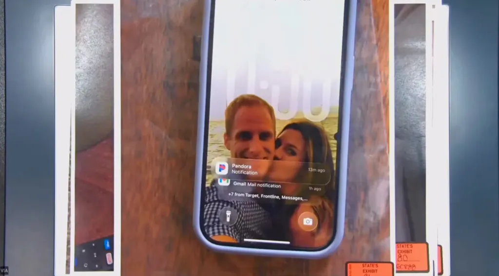 Smartphone displaying a lock screen photo of Caleb Flynn and his wife Ashley.