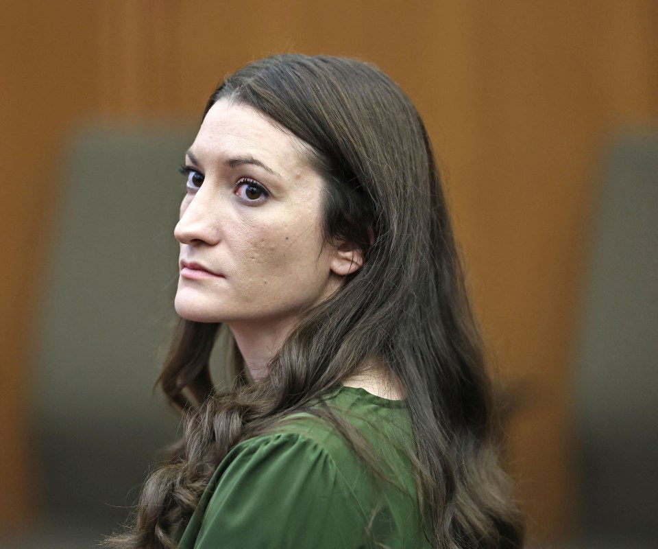 Lindsay Clancy watches jury members during her triple murder trial.