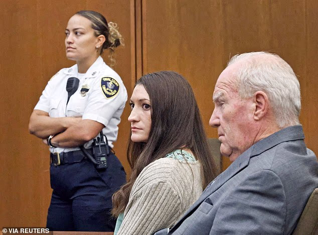 A pink sticker reading '#sidebah' and affixed to the drink holder on Lindsay Clancy's wheelchair was caught on camera by the official court photographer this week