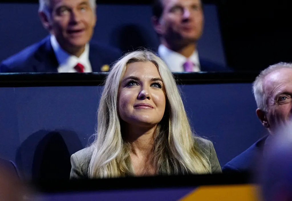 Erika Kirk, widow of Charlie Kirk, listens to President Donald Trump's keynote address.
