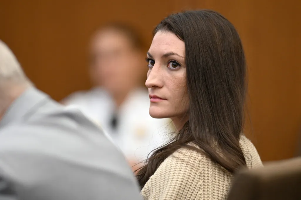 Lindsay Clancy looks toward reporters during her murder trial.