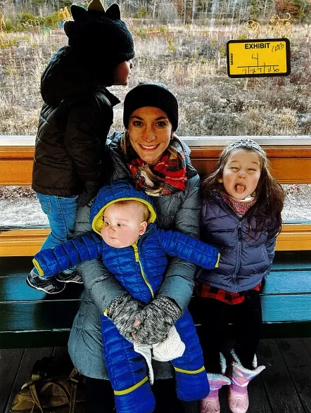Lindsay Clancy poses with her children Dawson, Callan, and Cora.