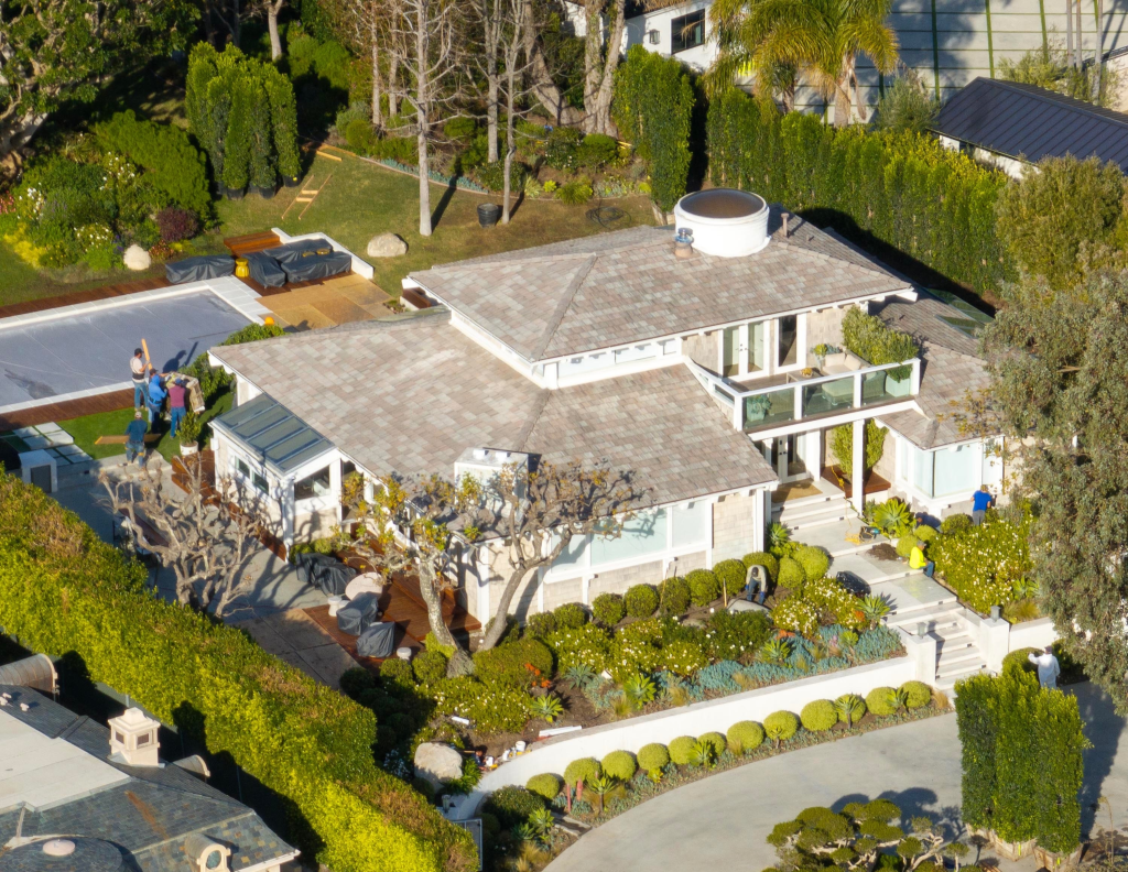 Aerial view of Kamala Harris's Malibu estate, showing workers making upgrades including privet hedging, a sauna, and steam room.