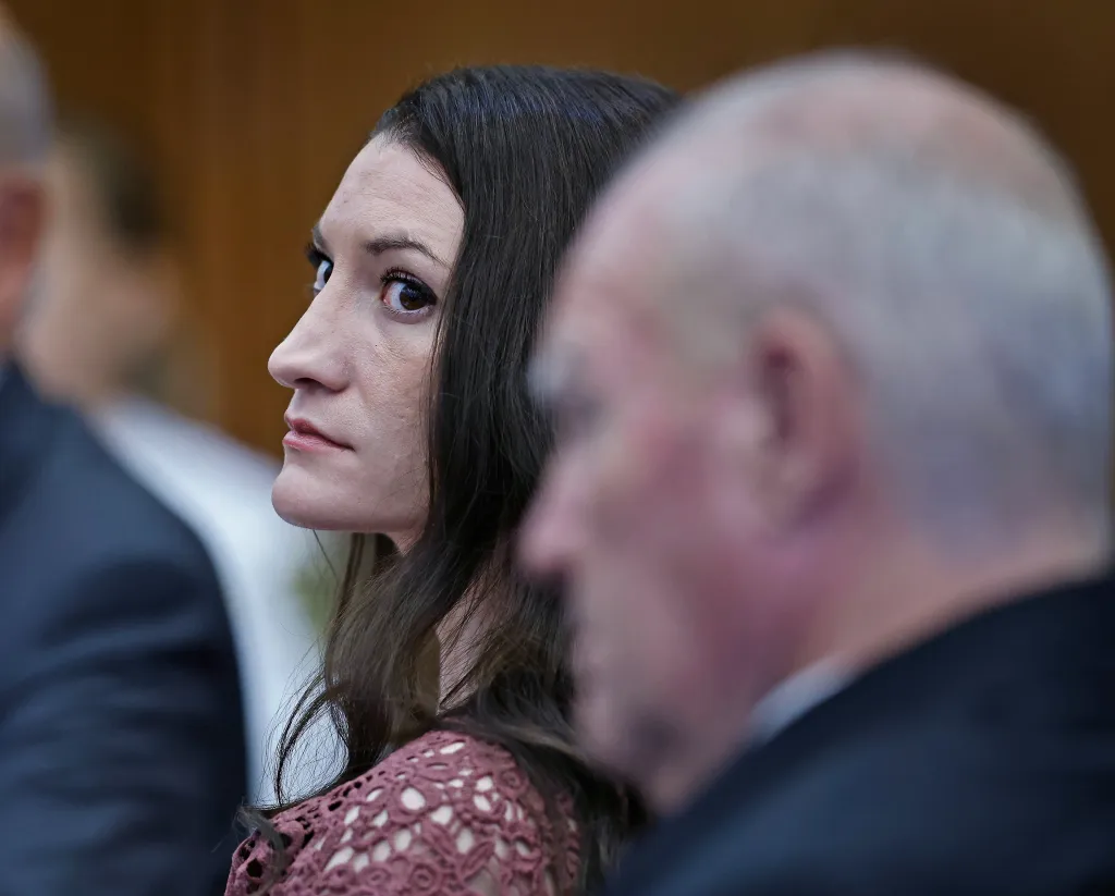 Defendant Lindsay Clancy listens to a motion in court while seated next to her attorney Kevin Reddington.