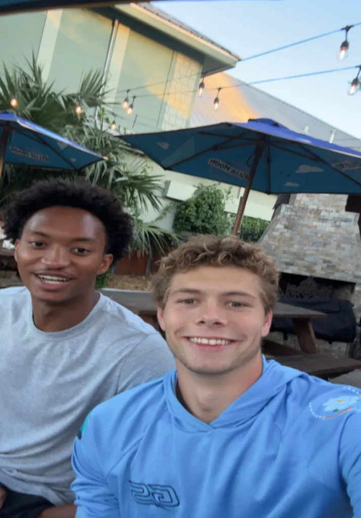 Photo of Warren and Jax smiling outdoors.