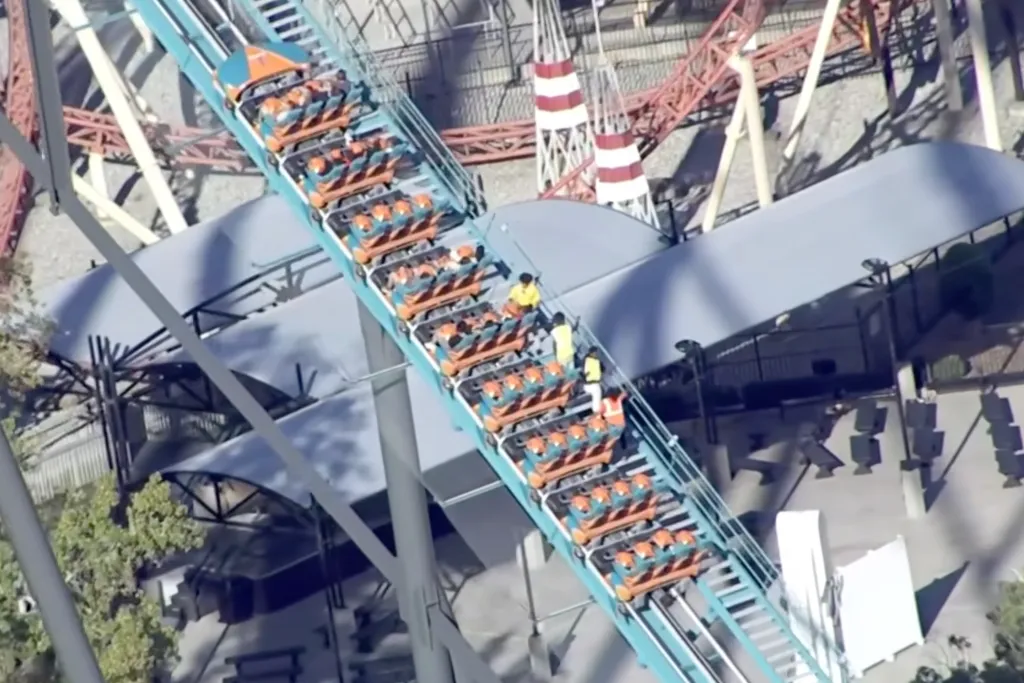 Aerial view of riders being escorted off a Six Flags Over Georgia roller coaster.