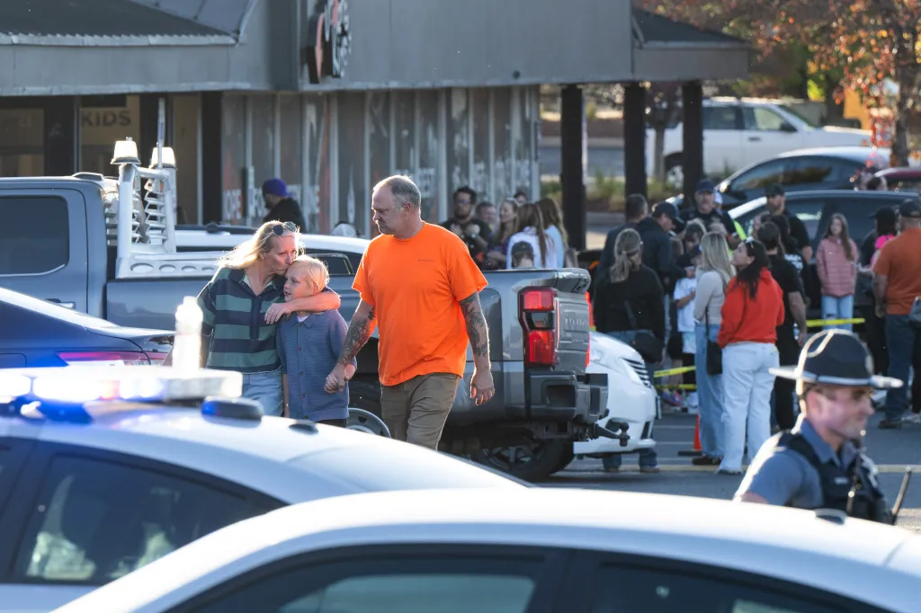 People leave a family meeting area following a shooting at Silver Rail Elementary School, on Oct. 16, 2026, in Bend, Ore.