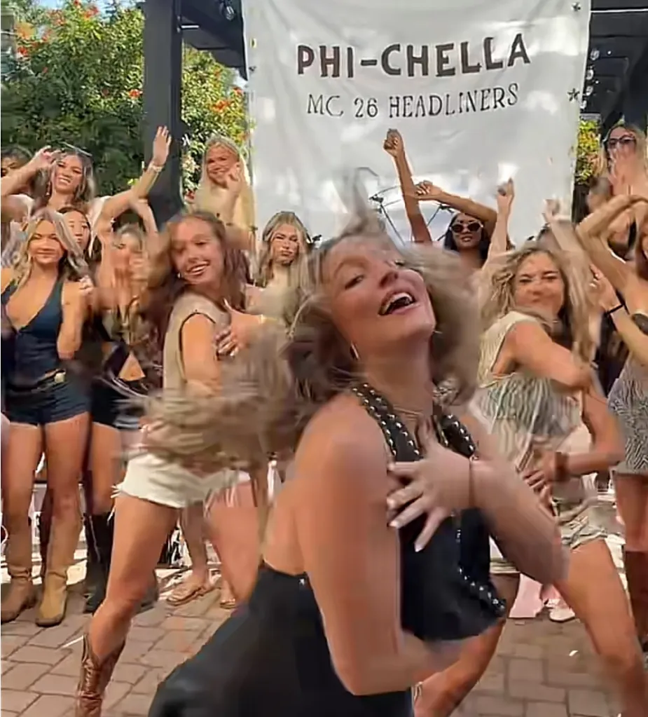 Members of the Alpha Phi sorority at UC Santa Barbara dance in front of a "Phi-Chella" banner during recruitment events.