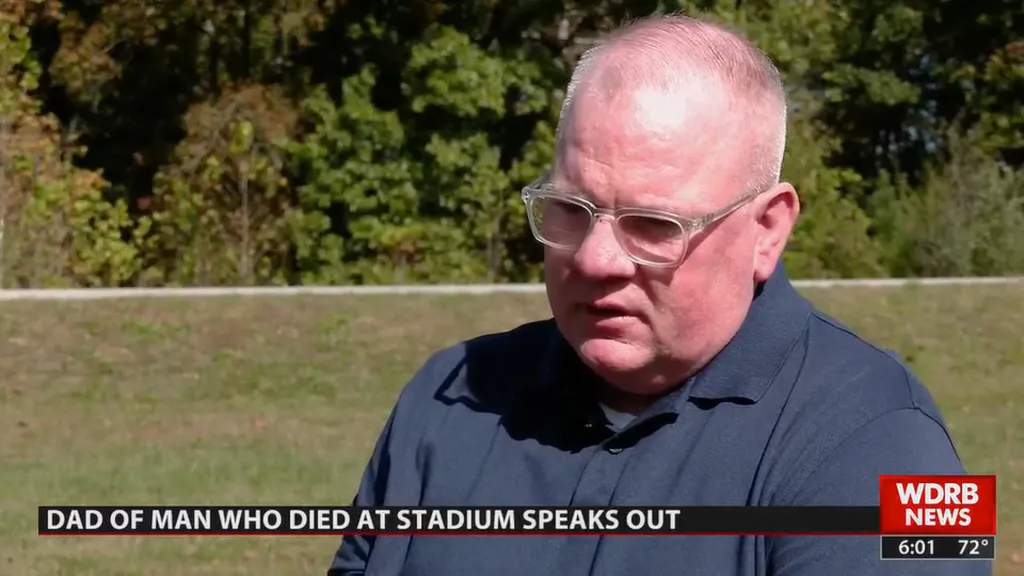 The father of Air Force Sergeant Ian Patterson being interviewed outdoors.