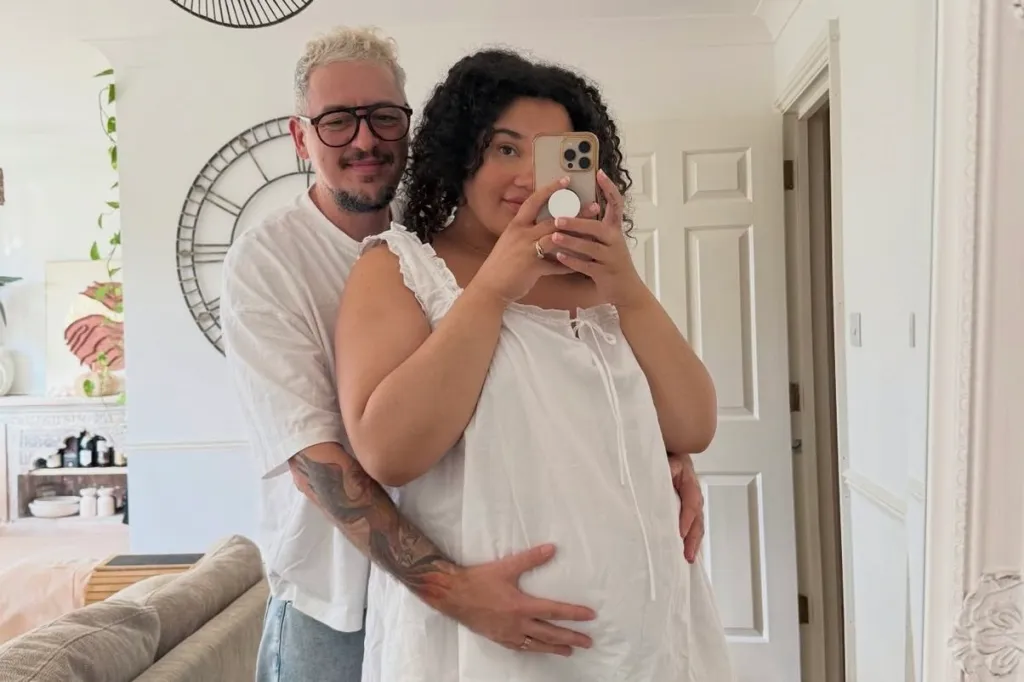 Taylor Winters and his wife, Chloe, pose for a mirror selfie in their home.