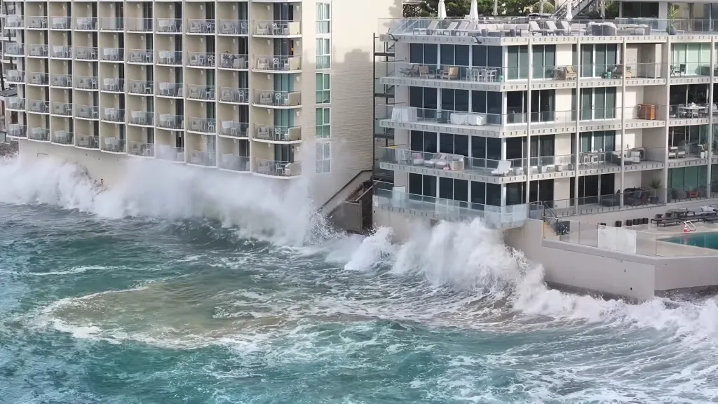 High tides crashing against coastal hotels in Laguna.