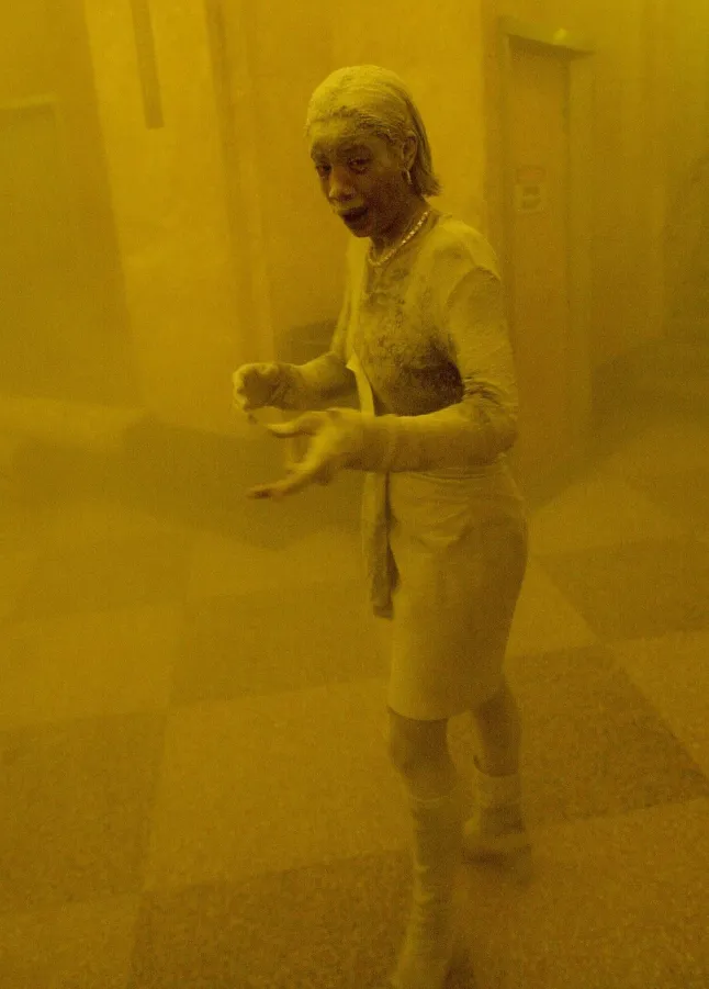 (FILES) This September 11, 2001 file pH๏τo shows Marcy Borders covered in dust as she takes refuge in an office building after one of the World Trade Center towers collapsed in New York. September 11, 2026, will mark the 25th anniversary of the September 11, 2001, attacks that killed nearly 3,000 people in New York, Washington and Pennsylvania. (PH๏τo by STAN HONDA / AFP via Getty Images)