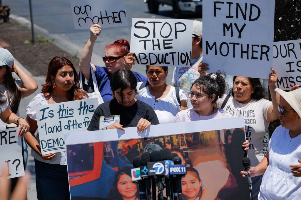 Family, friends, and community members hold signs and protest the disappearance of Yuriana Julia Pelaez Calderon in Los Angeles, California.