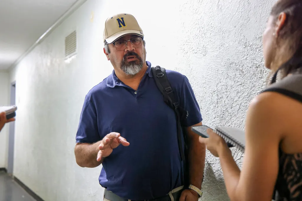 Patrick Peralta, brother of Pamela Cisneros, speaking to reporters.