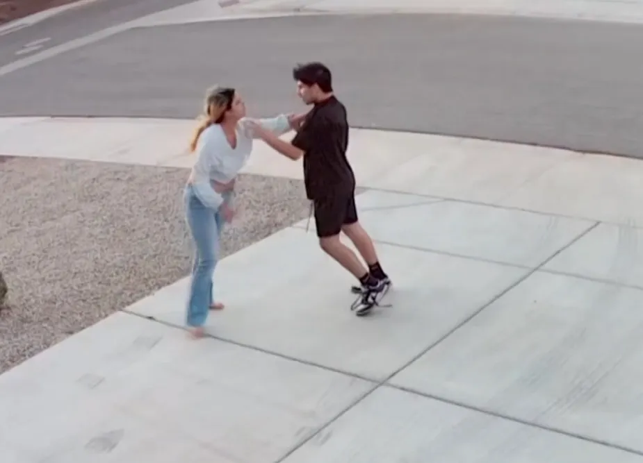 Bella Torres fighting off an intruder outside a home.