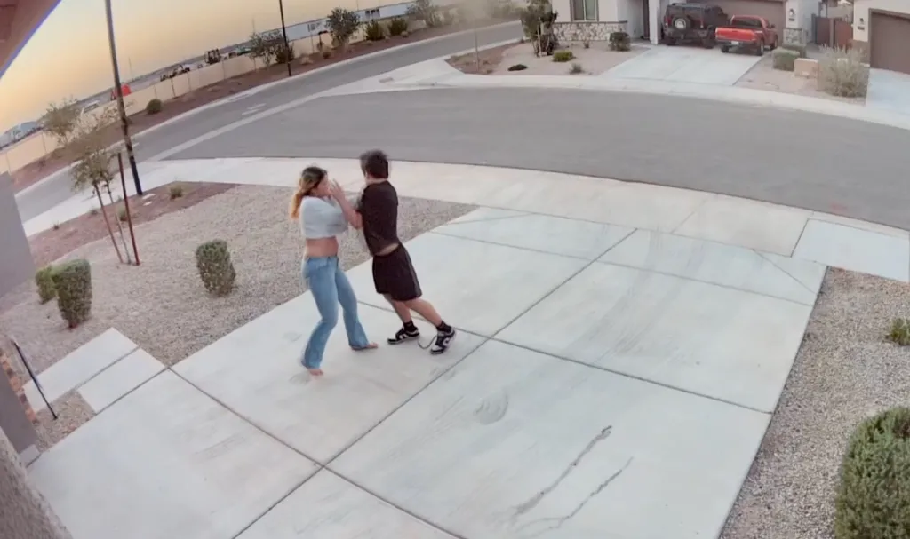 Home security footage obtained by AZ Family shows the victim struggling to fight off her attacker in the driveway — pushing him away, slapping him in the face and shouting at him as he leaned his weight into her.