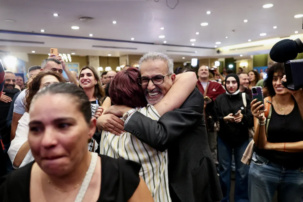 Members of the Joint List party celebrate and react to exit polls at their election headquarters in Nazareth.