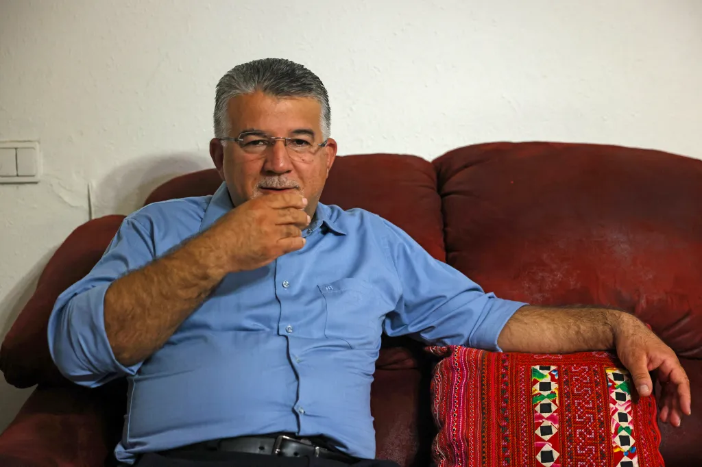 Yousef Jabareen sitting on a couch.
