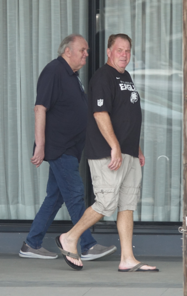 Thomas Markle and his son Thomas Markle Jr. walking outside an apartment building.