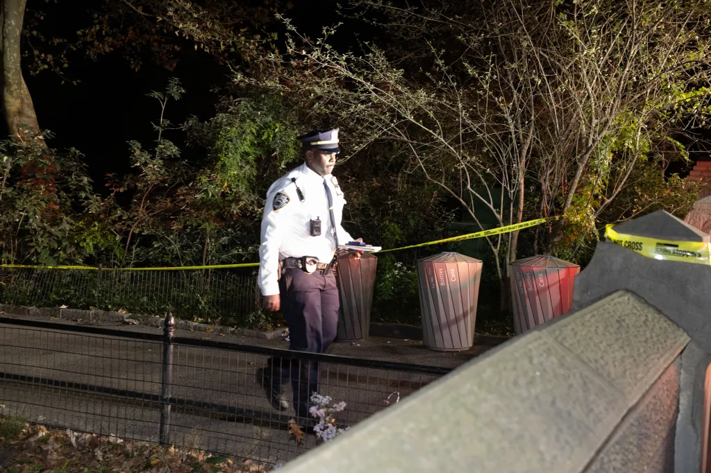 Police gather at the scene of the rape, the fifth such attack since January inside the renowned park.