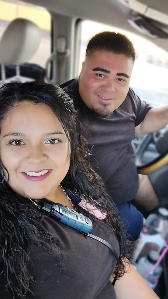 Angelica Aguirre and Shane Perez sitting inside a vehicle.