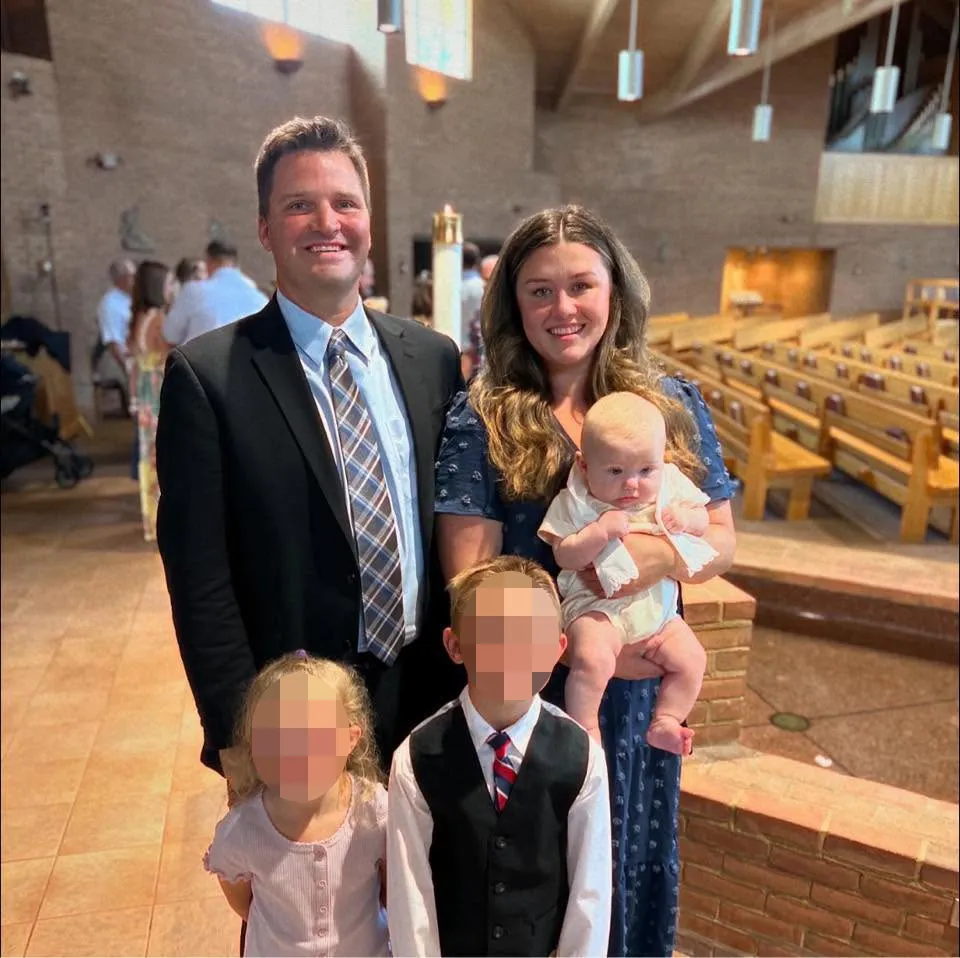 Corie Walsh and her family smiling for a photo.
