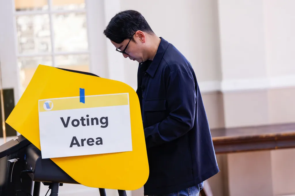 A person casts a ballot at a voting machine in Los Angeles, California.