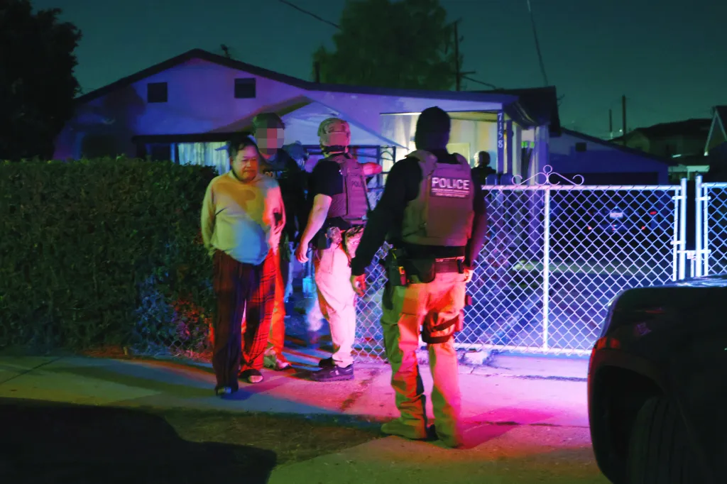 Law enforcement officers arrest Omar Alexander Muñoz at his residence in City of Commerce, California.