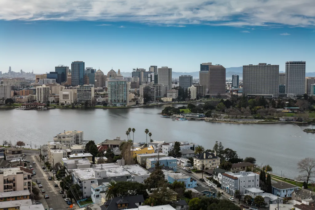 Aerial view of downtown Oakland across Lake Merritt on a sunny day.