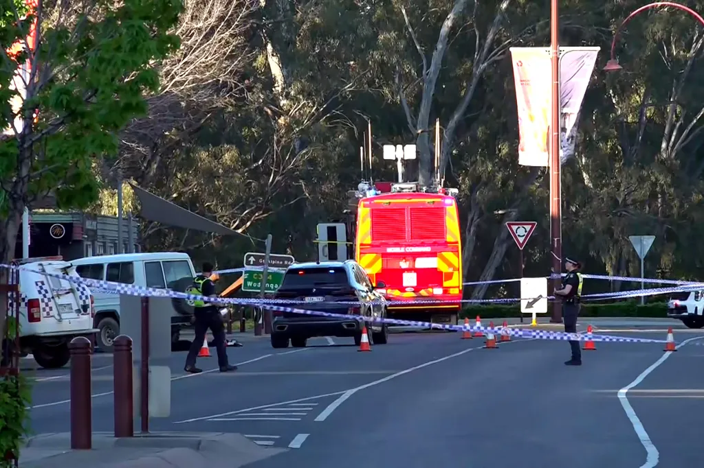 Police officers gather at the scene after Australian independent lawmaker Helen Haines was struck by a car outside her office in Wangaratta on Oct. 19, 2026.
