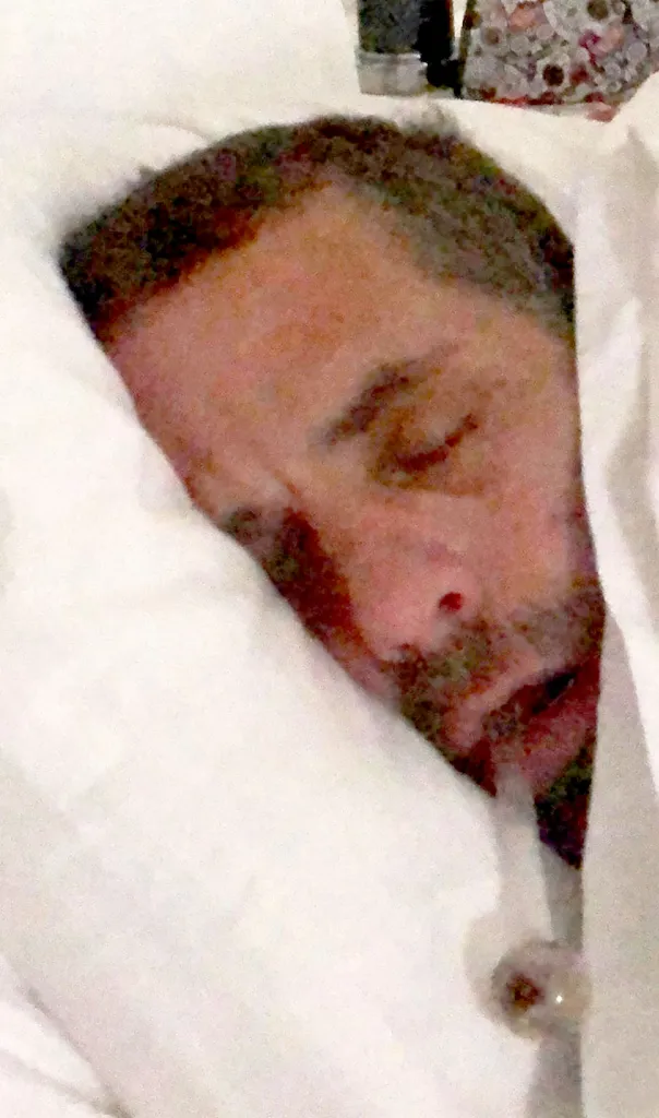 Hunter Biden lying in bed.