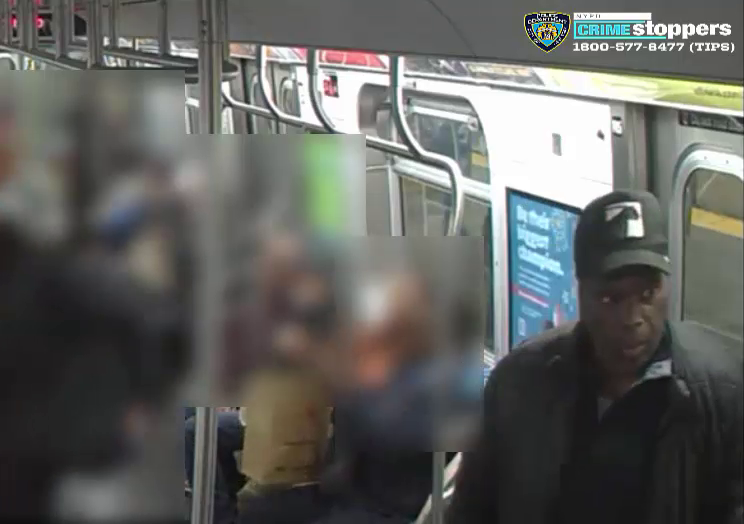 Surveillance still of a suspect aboard a subway train, with a Crime Stoppers logo in the upper right corner.