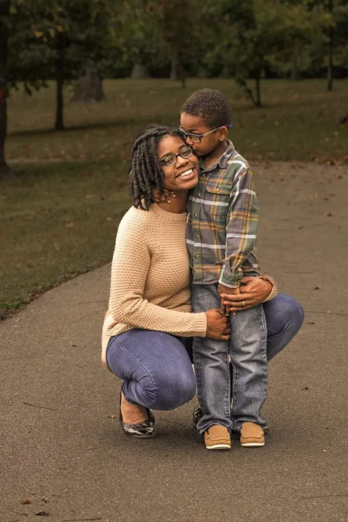 Shatayvia Alisha Calderon and her son Julian Calderon pose together outdoors.