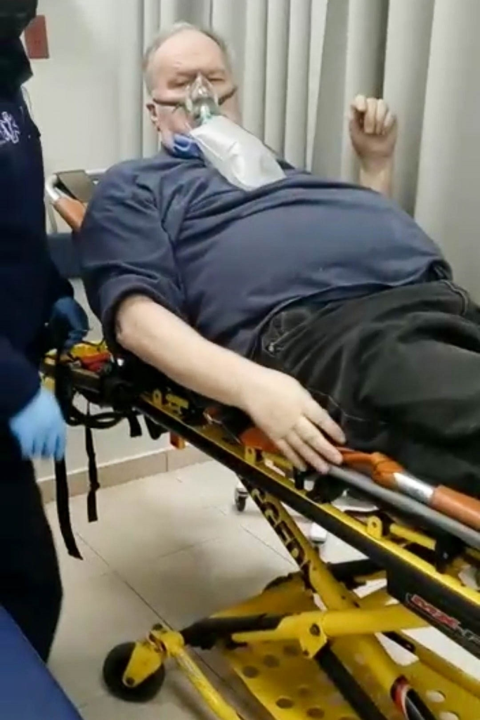 Thomas Markle arrives at a hospital in Tijuana on a gurney with an oxygen mask.