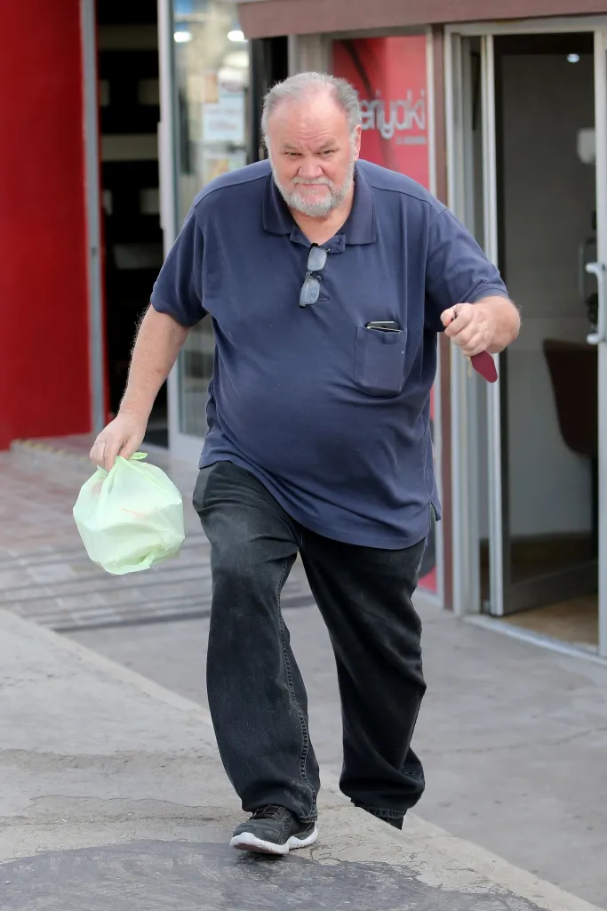 Thomas Markle carries a to-go meal from a Japanese restaurant in Rosarito, Mexico.