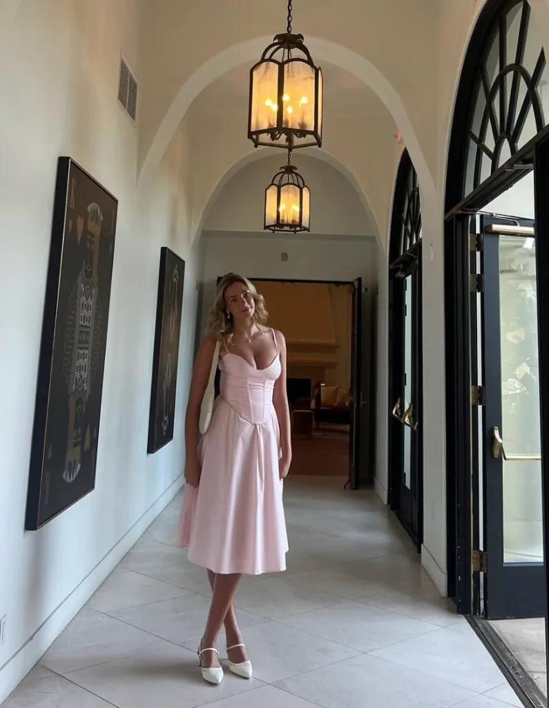 Loyola Marymount University student Talia Behrens poses for a photo in a hallway.