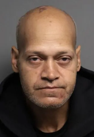 Jorge "George" Ortiz, 57, was arrested after a brief foot chase Monday to end a week-long manhunt where he was charged with murder.