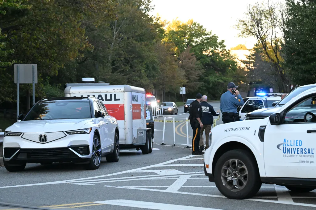 Emergency personnel and police vehicles block a New Jersey road where an incident occurred.