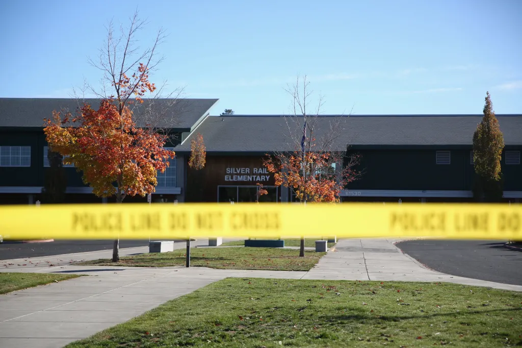 Silver Rail Elementary School with a yellow police crime scene tape in the foreground.