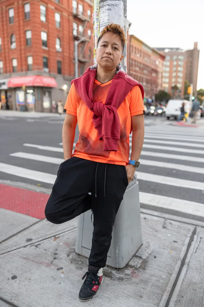 Katherine Marroquin poses for a photo on a street in the Bronx.