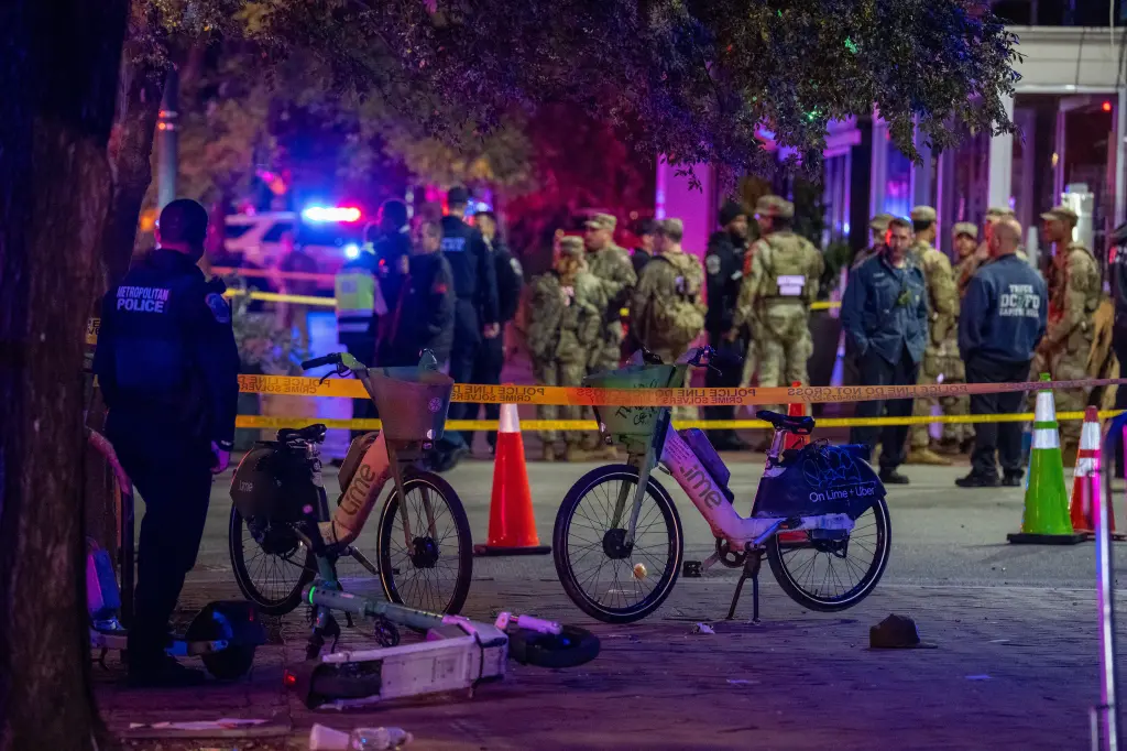 A National Guard soldier stands near the scene where a guard member was shot in the Eastern Market neighborhood of Washington, D.C.