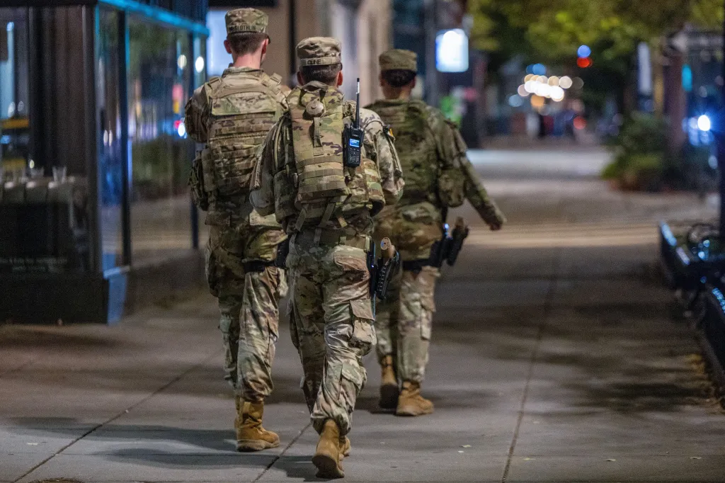 National Guard members patrol a street in Washington, D.C.